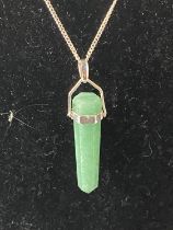 A 925 silver green stone necklace and pendant