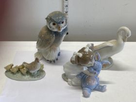 Four assorted Nao figurines