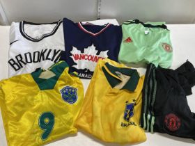 A selection of assorted football shirts and shorts (mixed sizes), (authenticity unknown)