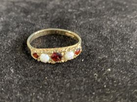 A 9ct gold red garnet and opal ring size Q 3.04g