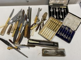 A selection of vintage boxed cutlery and other flatware