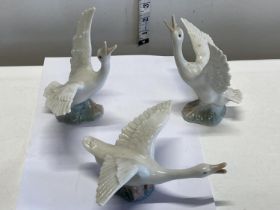 Three Lladro geese figurines