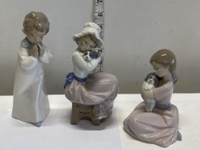 Three Nao figurines