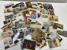 A job lot of assorted vintage and antique postcards