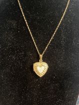 A 9ct gold chain and pendant 7.94g. Chain length 46cm overall.