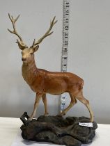A Beswick highland stag figurine (damage to one antler)