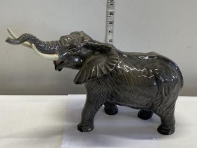 A large Beswick bull elephant (repair to one tusk)