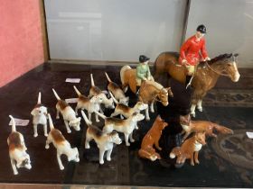 A Beswick hunting set including rider, dogs, foxes
