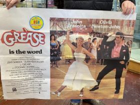 A Grease movie poster. Approx size 74cm x 100cm.