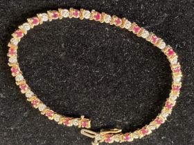 A 9ct gold Ruby and Diamond bracelet. 18.5cm overall length.