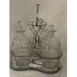 A chrome and glass three bottle decanter set a/f