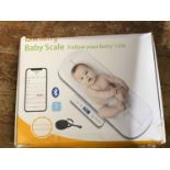 A boxed electric set of baby scales (untested)