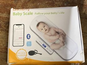 A boxed electric set of baby scales (untested)