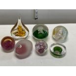 A selection of assorted paperweights including Caithness and other signed paperweights