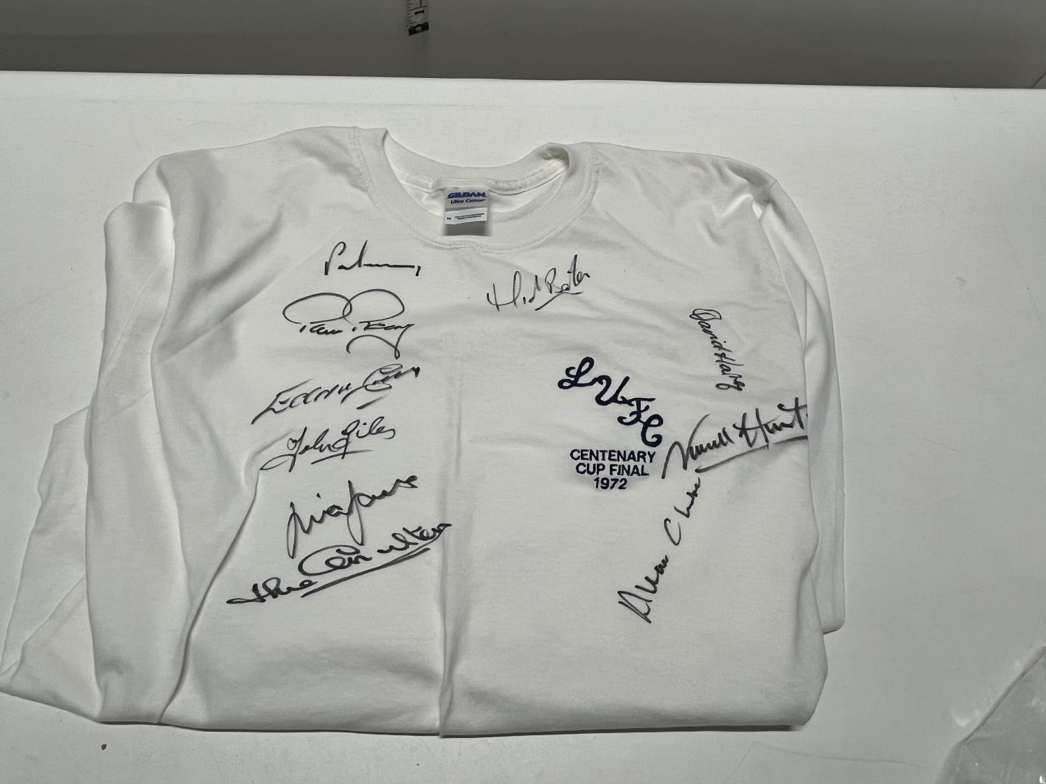 A signed replica Leeds United 1972 FA cup winning shirt signed by Alan Clarke, Eddy Grey, Jack