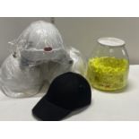 Three new safety hats and a safety basketball hat and a large selection of new ear plugs