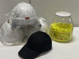 Three new safety hats and a safety basketball hat and a large selection of new ear plugs