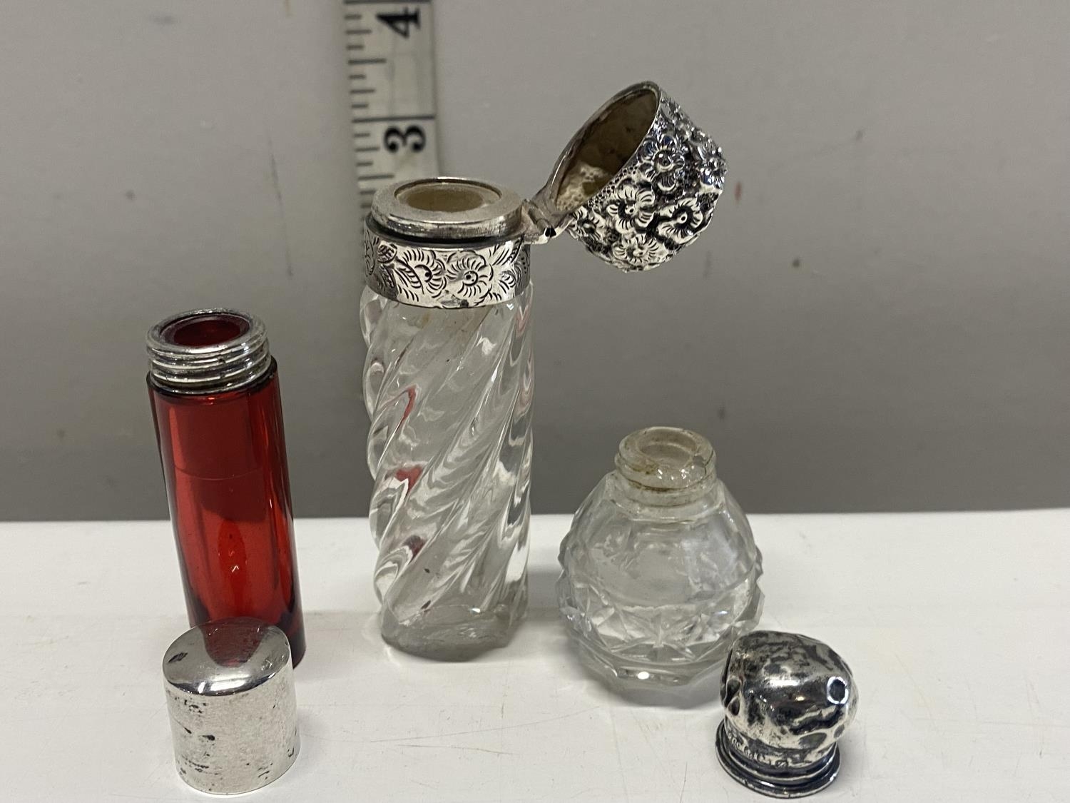A selection of silver topped scent bottles a/f