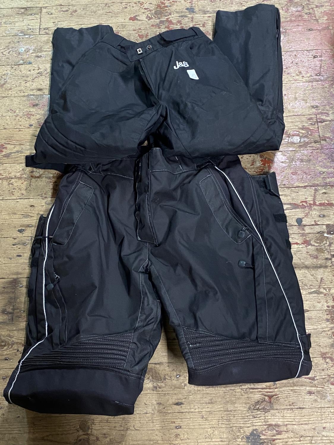 Two pairs of motorbike trousers