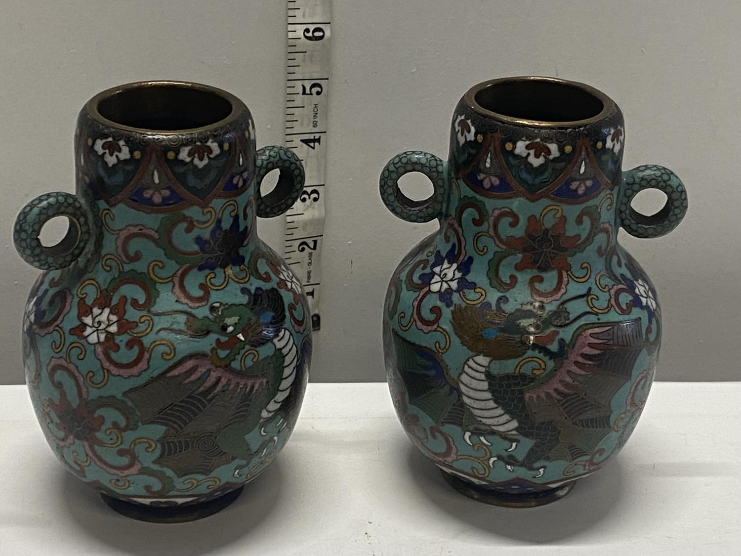 A pair of Chinese early 20th century Cloisonne vases with dragon decoration, signed to the base