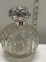 A vintage hob nail cut and hallmarked silver topped scent bottle (missing stopper, damage to silver)