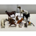 A selection of assorted ceramic figurines including Beswick a/f