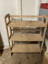 A collapsible wooden shelving unit, shipping unavailable