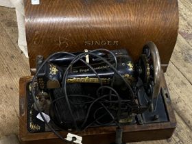 A vintage Singer sewing machine, shipping unavailable