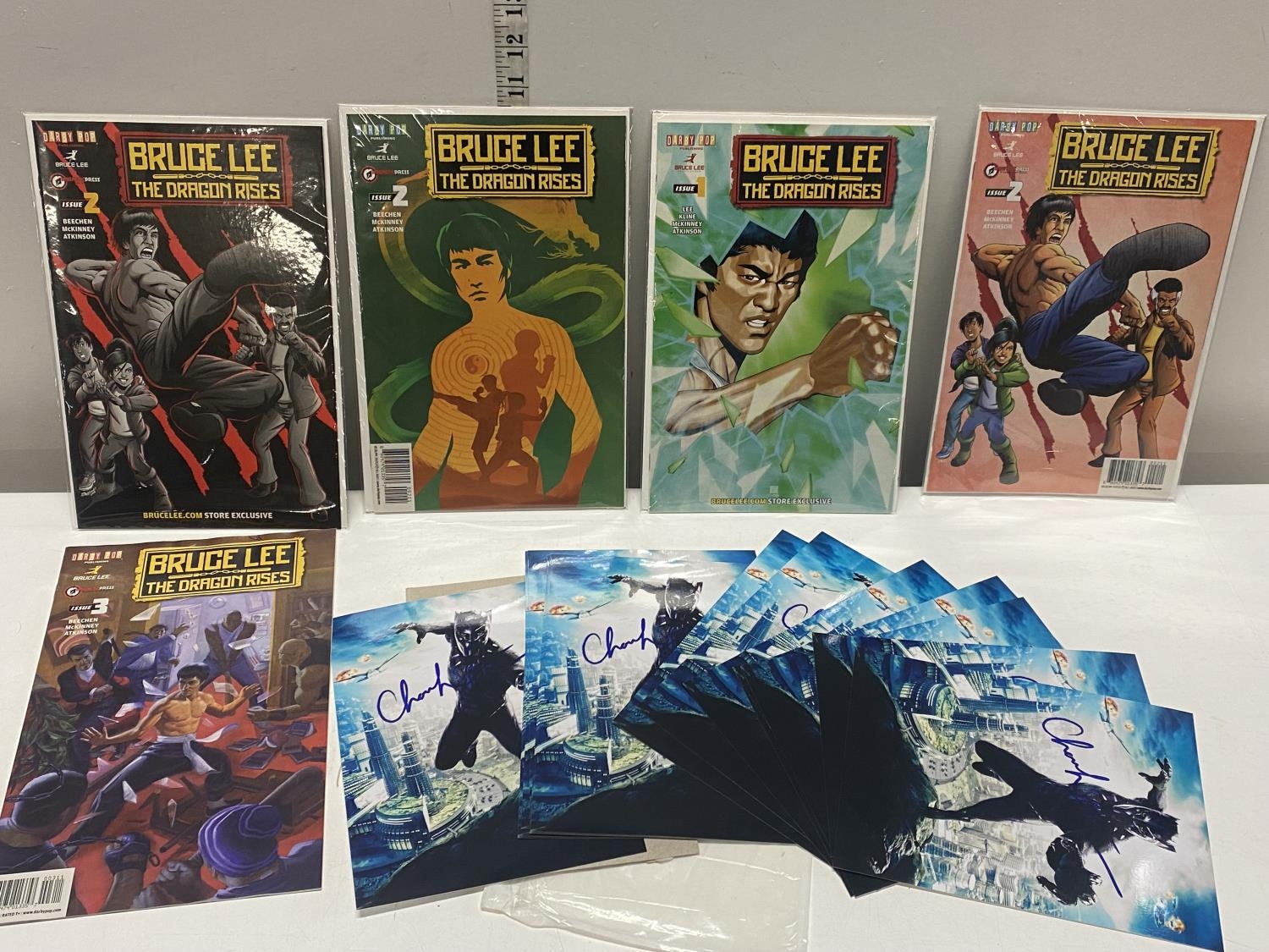 Five Derby Pop Bruce Lee magazines and a selection of Black Panther publicity cards