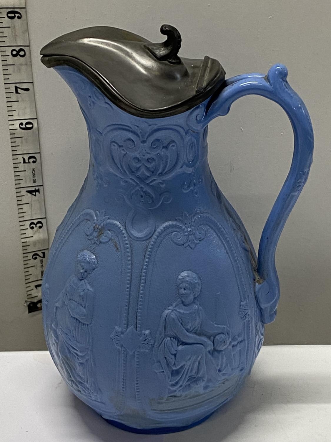A early mid-Victorian Staffordshire moulded jug with pewter lid, h25cm