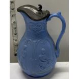 A early mid-Victorian Staffordshire moulded jug with pewter lid, h25cm