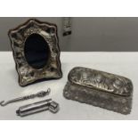 A job lot of hallmarked silver items including small photo framed and cheroot holder case