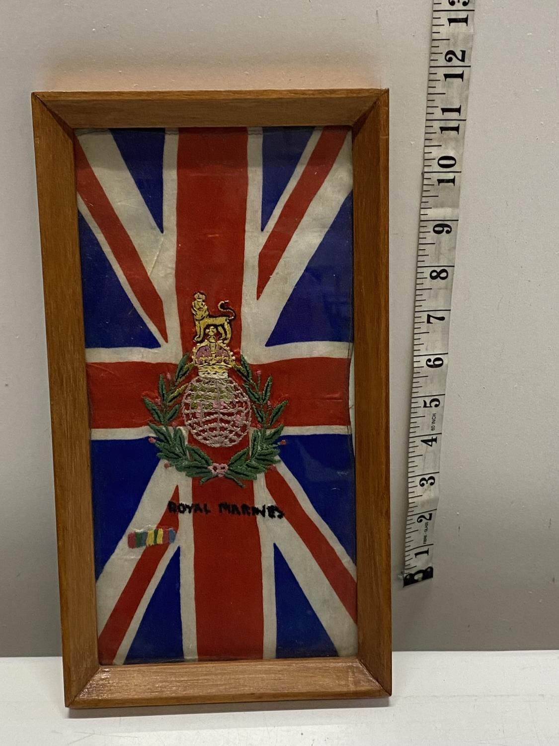 A framed hand sewn Royal Marines themed Union Jack, 29x26cm