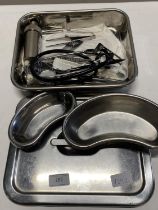 A set of medical instruments in stainless steel box