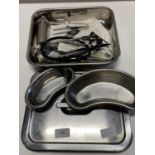A set of medical instruments in stainless steel box