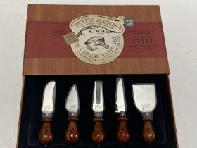 A new boxed Cheese knife set