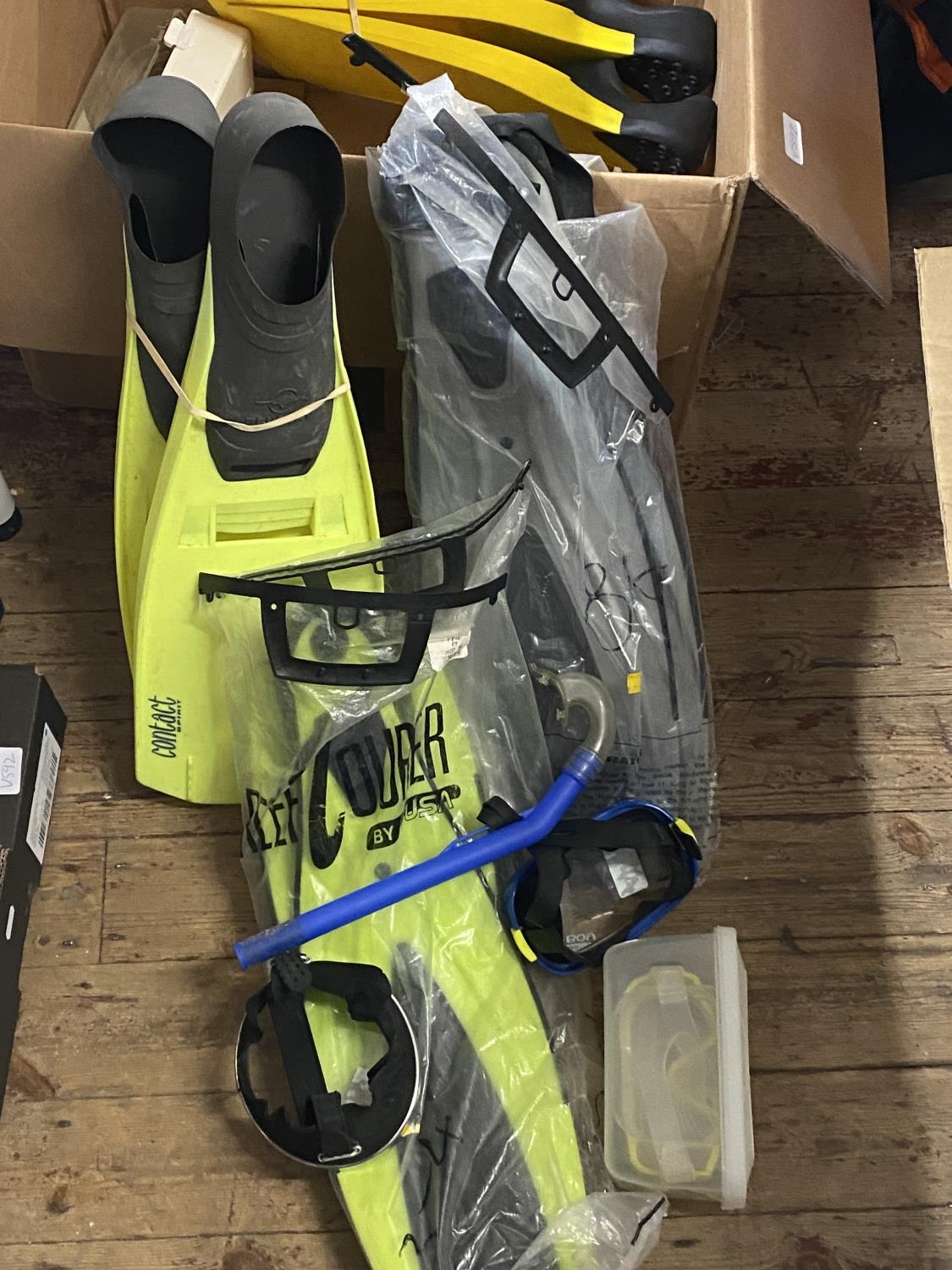 A box full of assorted snorkelling equipment