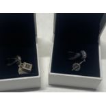 Two boxed Pandora charms