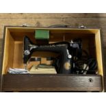 A boxed vintage Singer electric singer sewing machine (untested), shipping unavailable