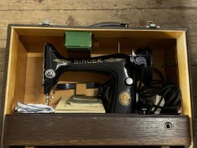 A boxed vintage Singer electric singer sewing machine (untested), shipping unavailable