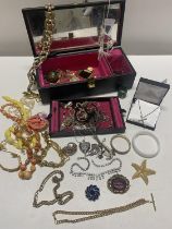 A jewellery box and contents of costume jewellery