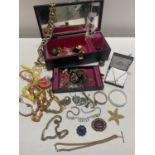 A jewellery box and contents of costume jewellery