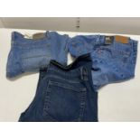 Three pairs of new adults jeans including Levi and Wrangler