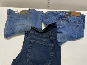 Three pairs of new adults jeans including Levi and Wrangler