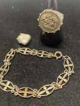 A silver ring, bracelet and locket