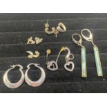 A selection of 925 silver earrings and pendants