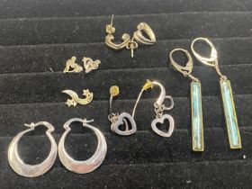 A selection of 925 silver earrings and pendants