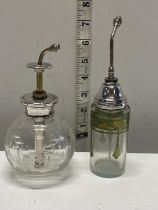 Two silver topped atomizer spray bottles