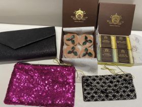 A selection of boxed handmade soap bars and evening bags