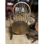 A vintage Ercol low slung rocking chair, shipping unavailable